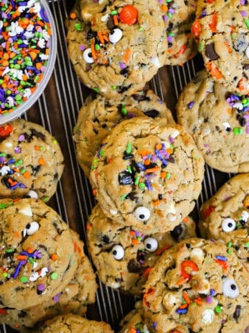 monster cookies on cooling rack with halloween sprinkles