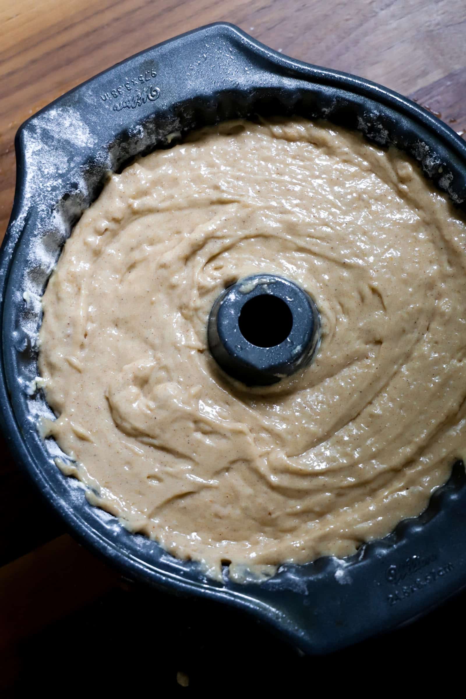 apple cider donut cake batter in pan